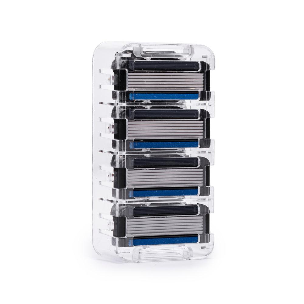 Four Earnest Empire six-blade refill cartridges with blue lubrication strips in a clear holder.