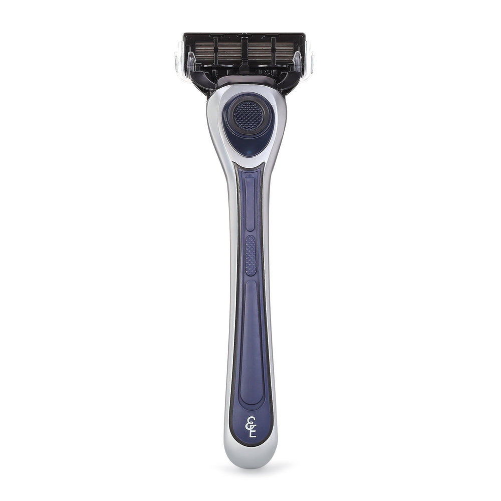 Rear view of the Earnest Empire razor with a navy and silver handle and attached cartridge.