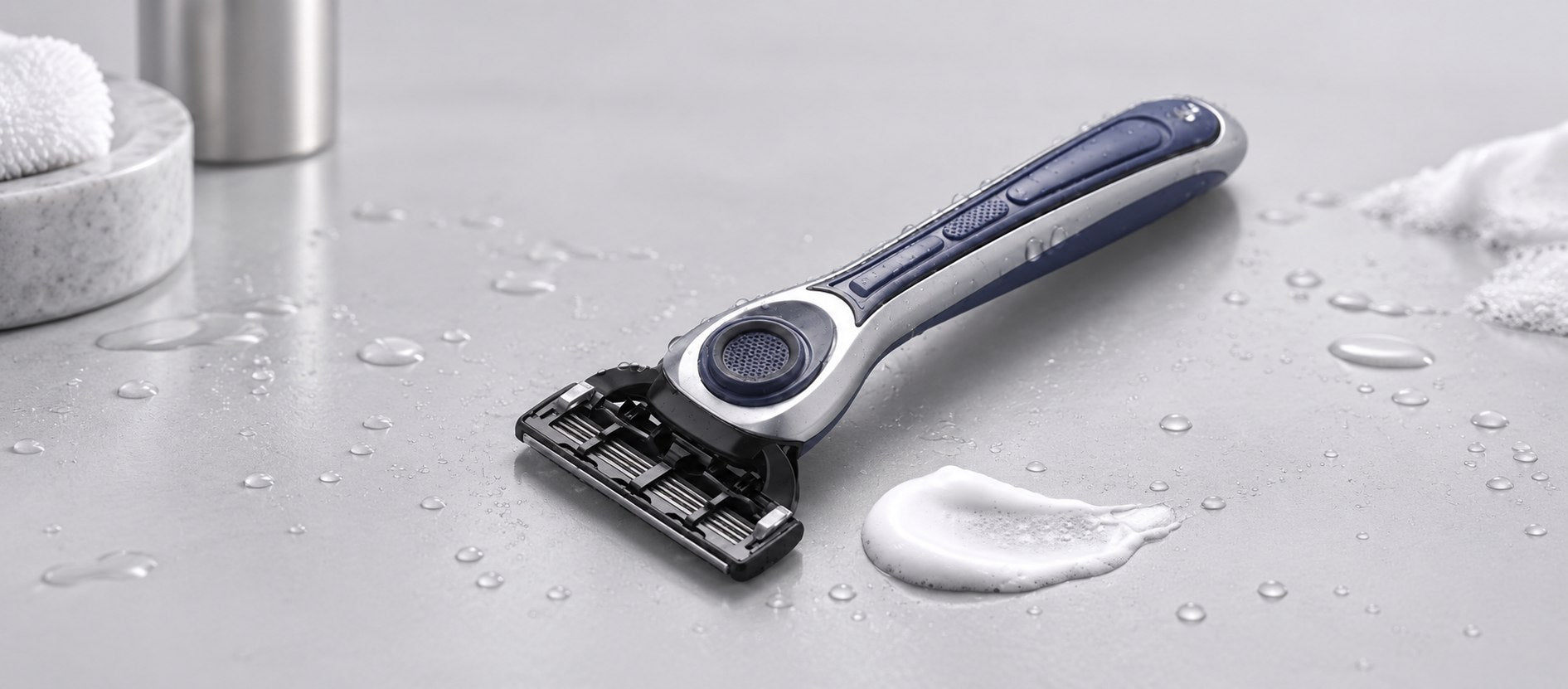 Earnest Empire razor on a wet stone surface with shaving lather